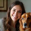 Client Yasmin smiling with Oscar the Spaniel